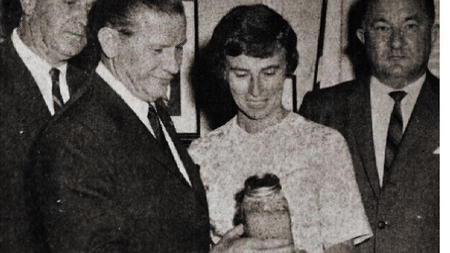 Marion Stoddart with Gov. John Volpe and bottle of contaminated water